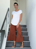caraucci women's burnt orange wide leg cropped flare pants #color_copper