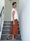 caraucci women's burnt orange wide leg cropped flare pants #color_copper