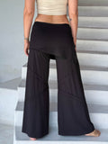 women's skirt over black wide leg pants with raised diagonal stitching #color_black