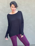 women's plant-based black relaxed fit jersey long sleeve top #color_black